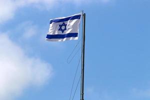 The blue and white flag of Israel with the six-pointed Star of David. photo