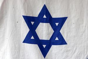 The blue and white flag of Israel with the six-pointed Star of David. photo