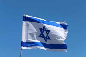 The blue and white flag of Israel with the six-pointed Star of David. photo