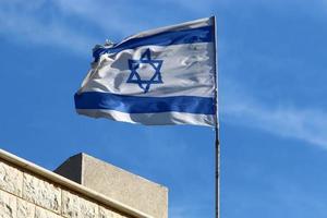 The blue and white flag of Israel with the six-pointed Star of David. photo