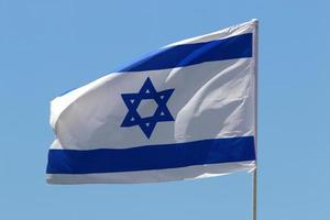 The blue and white flag of Israel with the six-pointed Star of David. photo