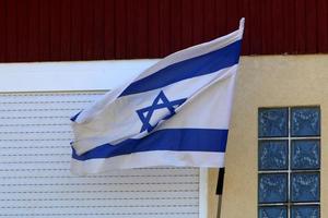 The blue and white flag of Israel with the six-pointed Star of David. photo