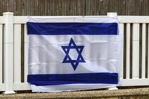 The blue and white flag of Israel with the six-pointed Star of David. photo