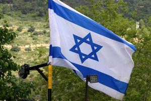 The blue and white flag of Israel with the six-pointed Star of David. photo