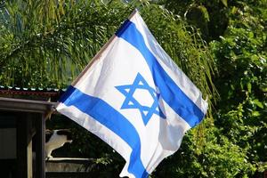 The blue and white flag of Israel with the six-pointed Star of David. photo