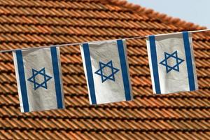 The blue and white flag of Israel with the six-pointed Star of David. photo