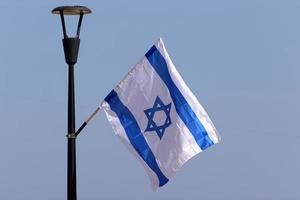 The blue and white flag of Israel with the six-pointed Star of David. photo