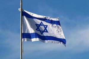 The blue and white flag of Israel with the six-pointed Star of David. photo