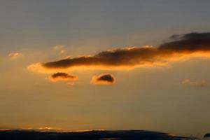 Sunrise on the shore of the Dead Sea in Israel. The sun rises from behind the mountains in Jordan. photo