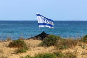 The blue and white flag of Israel with the six-pointed Star of David. photo