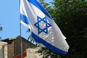 The blue and white flag of Israel with the six-pointed Star of David. photo