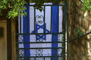 The blue and white flag of Israel with the six-pointed Star of David. photo