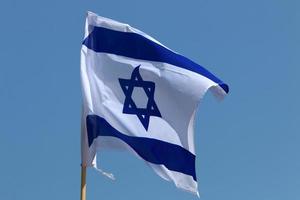 The blue and white flag of Israel with the six-pointed Star of David. photo