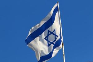 The blue and white flag of Israel with the six-pointed Star of David. photo