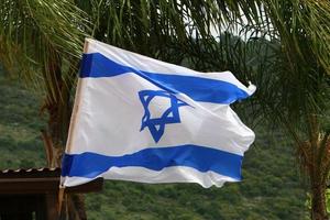 The blue and white flag of Israel with the six-pointed Star of David. photo