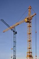 Tower crane against a blue sky photo