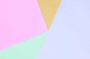 Texture background of fashion pastel colors. Pink, violet, orange and blue geometric pattern papers. photo