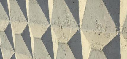 Texture of a relief concrete wall of beige color photo