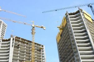 Construction site. High rise multi storey buildings under construction photo