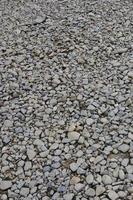 Texture of many crushed stones. Crushed stone is a solid base material for foundation photo