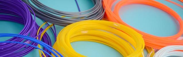 Plastic PLA and ABS filament material for printing on a 3D pen or printer of various colors photo