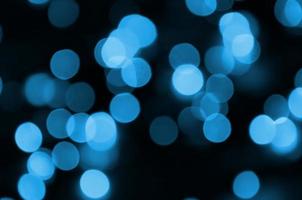 Blue Festive Christmas elegant abstract background with many bokeh lights. Defocused artistic image photo