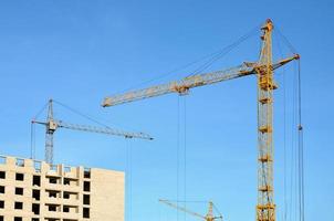 Building under construction with crane photo