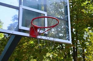Outdoor Basketball backboard with clear blue sky photo