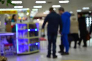 Blurred image of shopping mall interior photo