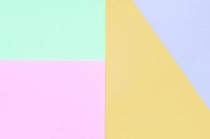 fondo de textura de colores pastel de moda. papeles con motivos geométricos rosas, violetas, naranjas y azules. foto