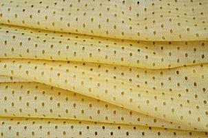 Yellow mesh sport wear fabric textile background pattern photo