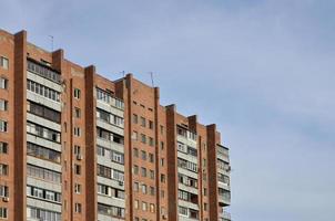 Old multi-storey apartment house in a poorly-developed region of Ukraine or Russia photo