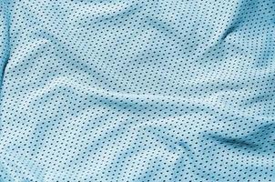 Sport clothing fabric texture background, top view of light blue cloth textile surface photo