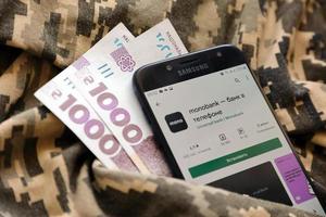 TERNOPIL, UKRAINE - APRIL 24, 2022 Monobank banking app on smartphone screen. Monobank is important commercial bank in Ukraine photo