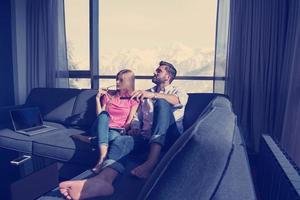 Young couple watching television photo