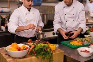 team cooks and chefs preparing meal photo