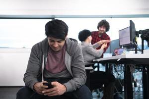 software developer using mobile phone photo