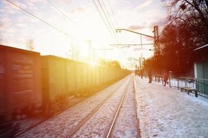 Evening winter landscape with the railway station photo