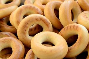 Close-up photo of fresh yellow bagels. A popular kind of flour products. One of the traditional Russian treats for tea