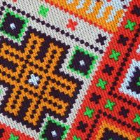 Traditional Ukrainian folk art knitted embroidery pattern on textile fabric photo