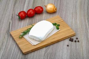 Feta cheese on wood photo