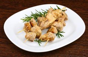 Chicken skewers on plate photo