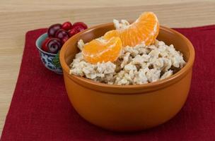 Oatmeal on wood photo