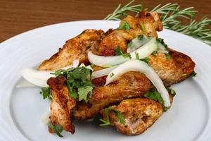 Chicken wings on wood photo