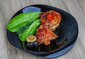 Teriyaki chicken on wood photo