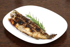 Grilled trout on wood photo