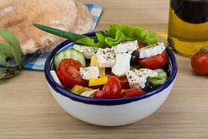 Greek salad on wood photo