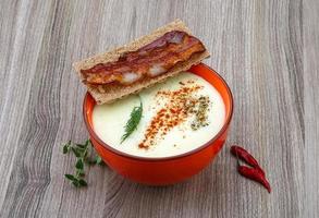 Cheese soup on wood photo