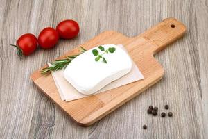 Feta cheese on wood photo