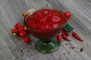 Tomato ketchup on wood photo